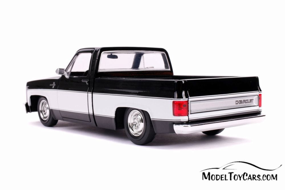 1985 Chevy C10 Pickup Stock, Glossy Black and White - Jada 31605
