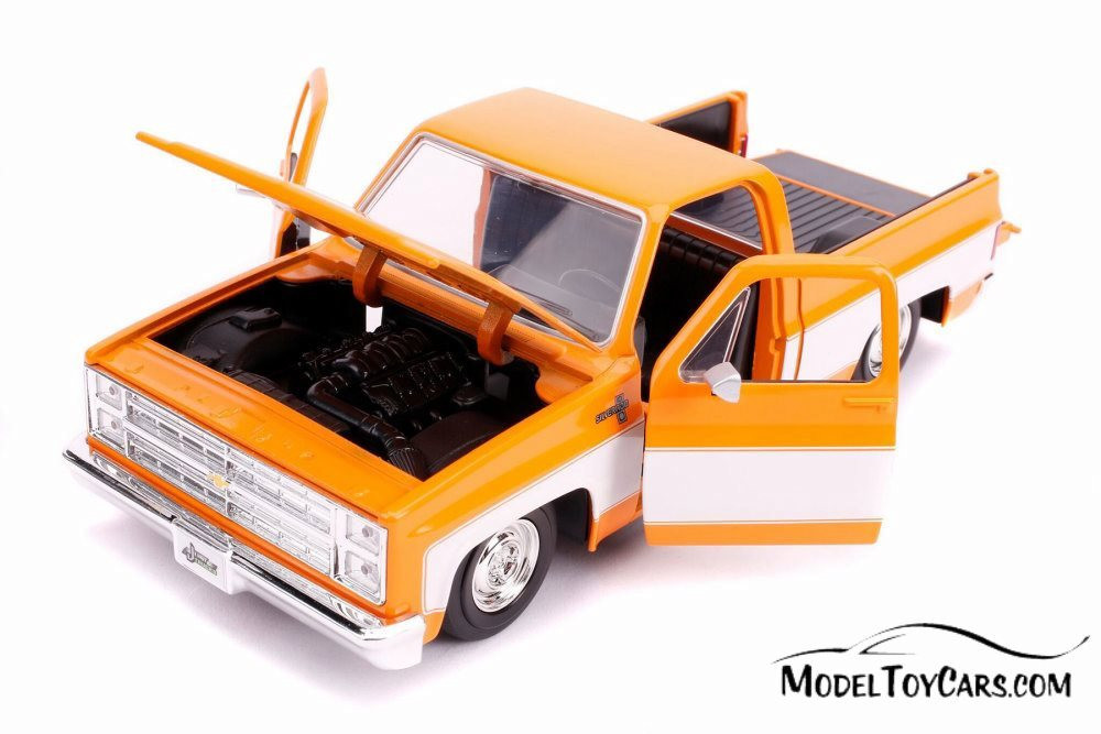 1985 Chevy C10 Pickup Stock, Glossy Orange and White - Jada 31607