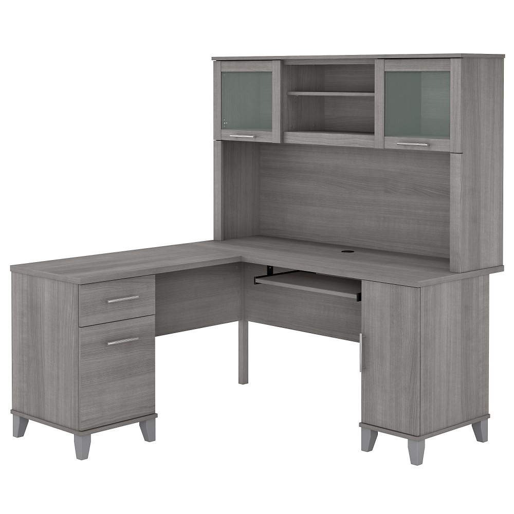 Make a professional statement and maximize your home office capabilities with the Somerset L-Shaped Desk with Hutch. The beautiful and functional corner desk design includes a vertical storage cabinet for binders, manuals or supplies. This expansive workspace allows plenty of room to complete large projects and storage solutions to stay organized.  Bundle includes: 60inW L-Desk and 60inW Hutch.  Constructed of laminate over engineered wood.  Expansive surface provides plenty of room for computer, phone, printer and more.  Pull-out keyboard or laptop tray, pedestals and hutch mount on left or right side for configuration flexibility.  Concealed storage cabinet for a computer tower or supplies with rear wire access.  Box drawer stores office supplies.  File drawer glides on smooth ball-bearing slides and accommodates letter-size documents.  Hutch has closed storage areas with lift-up frosted glass doors.  Open compartments in hutch for books, binders and decorations.  Meets ANSI/SOHO test standards for performance and safety.  Desktop weight tested to support 200 lb.  File drawers weight capacity tested to support 20 lb.  Assembled Dimensions: 59-1/6inW x 59-1/6inD x 64-1/2inH.  Assembly Required.  Standard Delivery Service. Furniture is delivered unassembled.  This product is heavy and/or oversized and may need more than one person to handle.