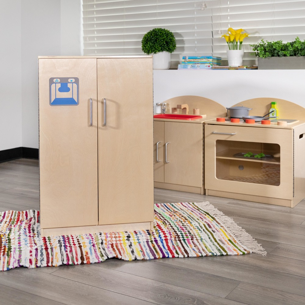 Create a play kitchen for your students with the Flash Furniture Childrens Wooden Kitchen Refrigerator. Interior shelves provide space for storing pretend groceries.  Made from durable engineered wood.  Rounded edges.  Fixed interior shelves.  Ice and water dispenser graphic.  Self-leveling glides help prevent wobbling.  Weight capacity tested to support 50 lb.  Assembly required.