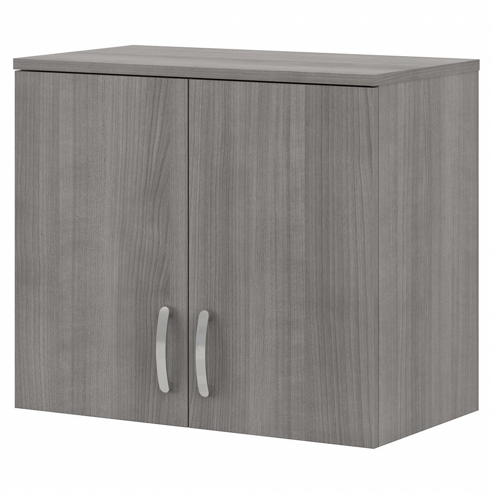 The Universal Wall Cabinet with Doors and Shelves features a commercial-quality design and contemporary styling that suits virtually any home or professional environment. Organize an office, break room, garage, laundry room or another work or living space with a wall-mounted cabinet thats built to last and comes in 3 attractive finish options.  Versatile Wall Cabinet with Doors and Shelves is a great way to organize any home or professional space.  Wall-mounted cabinet contains 1 fixed shelf and 1 adjustable shelf for flexible storage.  Cabinet doors feature smooth Euro-style hinges for an effortless open and close.  Studs should be mounted 16in apart for best use.  Installation may require additional tools.  Commercial-quality design can endure years of use as a break room or office storage cabinet, garage cabinet, laundry room cabinet and more.  Weight capacity tested to support 30 lb.  Backed by the Bush Furniture 10-Year Manufacturers Warranty. For additional information, please visit http://www.bushfurniture.com/ReturnsExchanges.aspx  Assembly required.  Standard Delivery Service. Furniture is delivered unassembled.  Assembled Dimensions: 28-1/3inW x 15-1/2inD x 24-1/6inH.