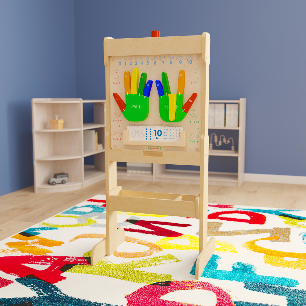 Encourage your students to be creative with a Flash Furniture Bright Beginnings Commercial Grade Double-Sided Wooden Free-Standing STEAM Easel With Storage Tray. The integrated storage tray allows students to keep paints, brushes, markers and other supplies close by.  Made from durable plywood.  Curved back legs offer strength and stability.  Rounded safety corners.  Includes a storage tray for art supplies.  Clear acrylic window accommodates water-based markers and paints.  Wipe clean with a damp cloth.  Assembly required.