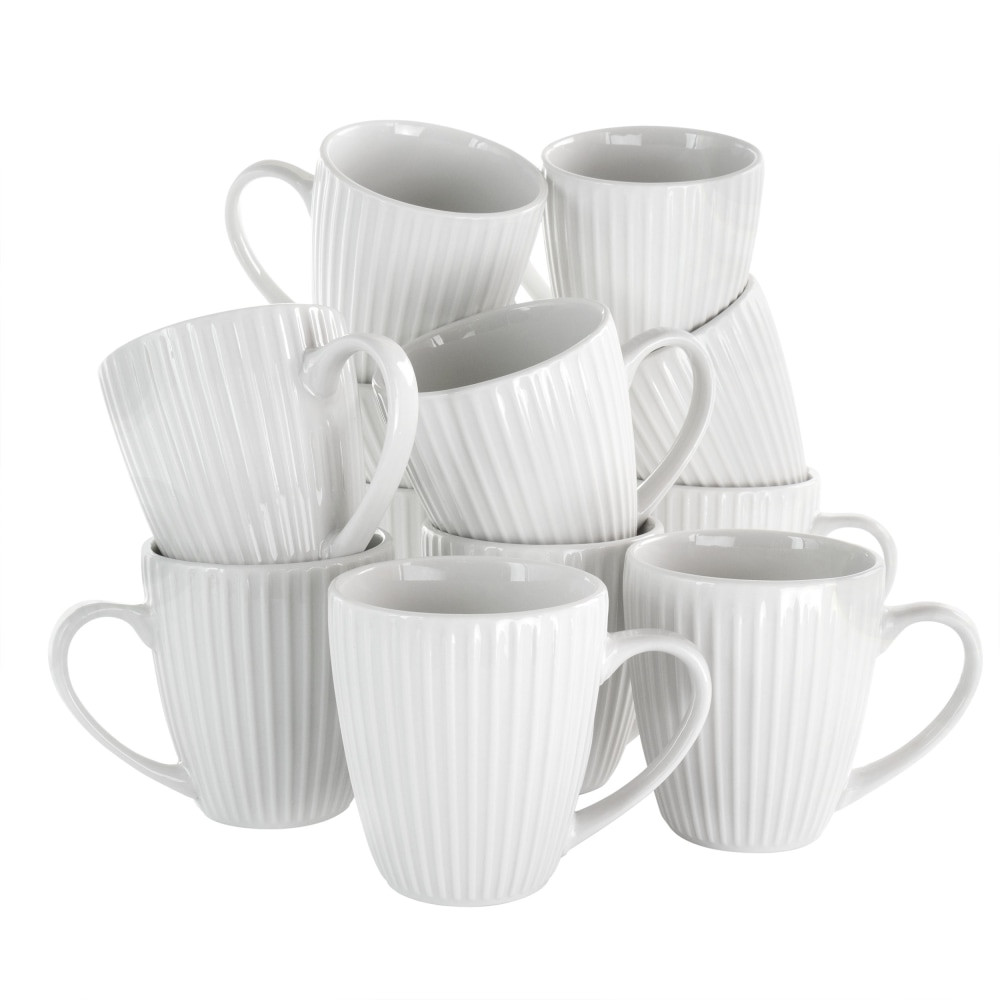 Serve coffee, tea and other hot drinks with this Elama Elle 12-Piece Round Mug Set. These porcelain mugs have a glossy finish that adds a sleek look to impress your guests.  Made from porcelain material.  Glossy finish.  Dishwasher and microwave safe.