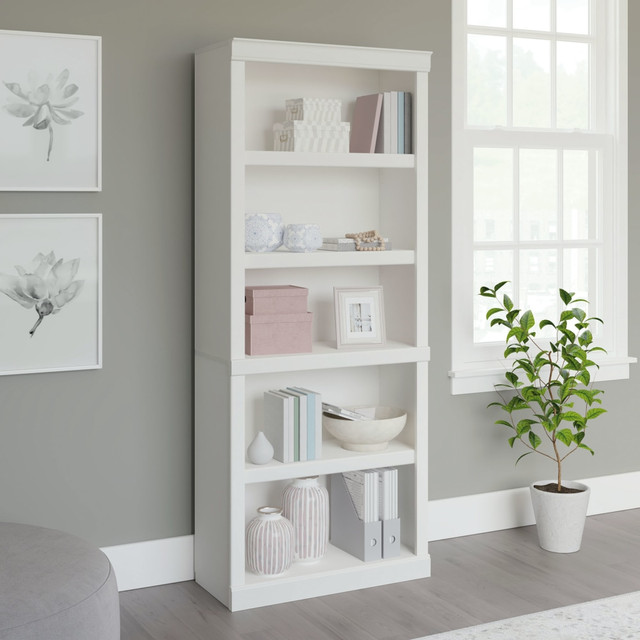 Prevent clutter from taking over your office with an elegant storage solution. This Realspace 72inH 5-Shelf Bookcase offers a style that reflects your upscale taste in furniture and has plenty of storage space. Arrange books, keepsakes, framed photos and your favorite awards along the shelves as well as accessory bins and baskets (sold separately) for loose supplies. The 3 adjustable shelves make it easy to accommodate the items you need and the pieces that help make your space feel personal.  Configure your space using adaptable pieces to help  you get organized.  Engineered-wood construction with decorative molding.  Attractive laminate finish.  5 shelves, including 3 adjustable.  Weight capacity tested to support 25 lb (adjustable shelves) and 35 lb (bottom shelf).  Assembly required.  Finished in arctic white.  Tested to meet ANSI/BIFMA Performance Standards - Manufacturer testing has been conducted on this product to meet specific performance requirements and safety standards set forth by the American National Standards Institute (ANSI) and the Business and Institutional Furniture Manufacturers.  This product is heavy and/or oversized and may need more than one person to handle.  Interested in in-home assembly? Please call our certified and insured professional assemblers 866-388-4350 today!