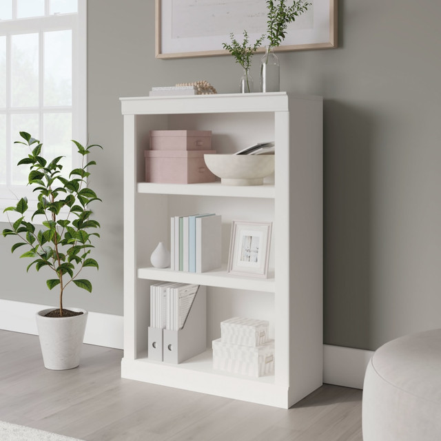 Give yourself more room to store the things you need as well as the decorative items that make your space truly yours with the Realspace 45inH 3-Shelf Bookcase. Position this sturdy bookcase in your space and arrange framed photos, keepsakes, books and supplies across the shelves. Two of the shelves are adjustable, making it easy to find room for everything you want to store. With its decorative molding and attractive finish, this bookcase makes a handsome addition to most any home or office.  Configure your space using adaptable pieces to help  you get organized.  Crafted from engineered wood with a laminate finish.  3 shelves, including 2 adjustable.  Accented with decorative molding.  Weight capacity tested to support 25 lb (adjustable shelves) and 35 lb (bottom shelf).  Assembly required.  Finished in arctic white.  Tested to meet ANSI/BIFMA Performance Standards - Manufacturer testing has been conducted on this product to meet specific performance requirements and safety standards set forth by the American National Standards Institute (ANSI) and the Business and Institutional Furniture Manufacturers.  Interested in in-home assembly? Please call our certified and insured professional assemblers 866-388-4350 today!