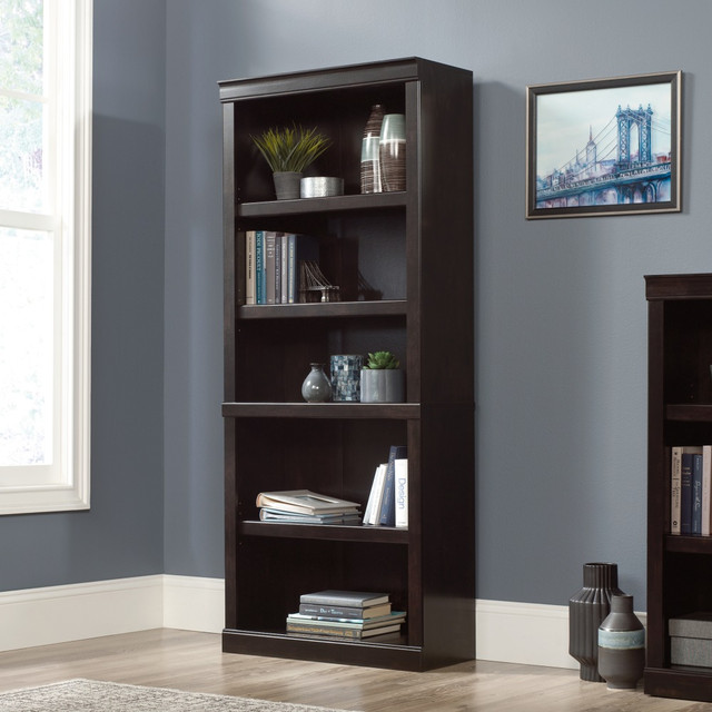 Prevent clutter from taking over your office with an elegant storage solution. This Realspace 72inH 5-Shelf Bookcase offers a style that reflects your upscale taste in furniture and has plenty of storage space. Arrange books, keepsakes, framed photos and your favorite awards along the shelves as well as accessory bins and baskets (sold separately) for loose supplies. The 3 adjustable shelves make it easy to accommodate the items you need and the pieces that help make your space feel personal.  Configure your space using adaptable pieces to help  you get organized.  Engineered-wood construction with decorative molding.  Attractive laminate finish.  5 shelves, including 3 adjustable.  Weight capacity tested to support 25 lb (adjustable shelves) and 35 lb (bottom shelf).  Assembly required.  Finished in peppered black.  Tested to meet ANSI/BIFMA Performance Standards - Manufacturer testing has been conducted on this product to meet specific performance requirements and safety standards set forth by the American National Standards Institute (ANSI) and the Business and Institutional Furniture Manufacturers.  This product is heavy and/or oversized and may need more than one person to handle.  Interested in in-home assembly? Please call our certified and insured professional assemblers 866-388-4350 today!