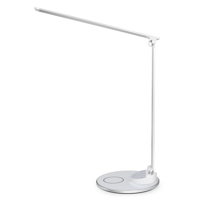 Illuminate your work space for efficiency with this sleek WorkPro LED desk lamp with USB and wireless charging. The 5 brightness and 5 color-temperature levels provide versatility, while the touch control panel enables you to make adjustments quickly. This eco-conscious WorkPro LED desk lamp features an adjustable design with a rotatable base and head allowing you to change the direction of light to multiple locations. Easily charge your device with its wireless charger by simply placing your device on the base. In addition, a convenient 2.4amp USB is located at the back of the base so you can charge secondary mobile devices. This sophisticated, modern lamp also includes memory function and its LED lighting can last up to 50,000 hours.  Elegant minimalistic modern design.  2.4-amp USB port and Wireless Charger on lamp base to conveniently power mobile devices.  Adjustable arm, head and base for a wide range of illumination.  5 color temperatures and 5 brightness levels.  Touch controls with memory function.  Energy-efficient, pre-wired, built in 400 lumen 7-watt LEDs that are not replaceable; however, the bulbs have a rated average life of approximately 50,000 usage hours.  Energy-efficient - designed to use less energy than alternative products, potentially helping you save money and reduce your carbon footprint.  Green rating based on energy efficient light bulb.  White lamp base.  Energy efficient - designed to use less energy than alternative products, potentially helping you save money and reduce your carbon footprint.