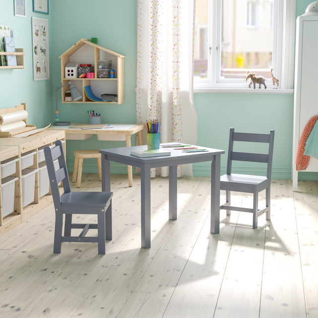 Set up a dedicated work or play space for your children with the Flash Furniture Kids 3-Piece Table And Chair Set. The durable tabletop boasts rounded edges for added safety. Both chairs offer a comfortable spot for kids to sit and study, draw, read and more.  Includes 1 square table and 2 chairs.  Cleat coating helps prevent tabletop splintering.  Mortise and tenon construction with wood screw reinforcements.  Rounded edges for safety.  Recommended for ages 5-7.  Weight capacity tested to support 200 lb (table) and 170 lb (chairs).  Assembly required.
