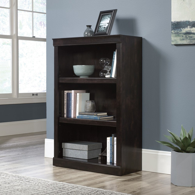 Give yourself more room to store the things you need as well as the decorative items that make your space truly yours with the Realspace 45inH 3-Shelf Bookcase. Position this sturdy bookcase in your space and arrange framed photos, keepsakes, books and supplies across the shelves. Two of the shelves are adjustable, making it easy to find room for everything you want to store. With its decorative molding and attractive finish, this bookcase makes a handsome addition to most any home or office.  Configure your space using adaptable pieces to help  you get organized.  Crafted from engineered wood with a laminate finish.  3 shelves, including 2 adjustable.  Accented with decorative molding.  Weight capacity tested to support 25 lb (adjustable shelves) and 35 lb (bottom shelf).  Assembly required.  Finished in peppered black.  Tested to meet ANSI/BIFMA Performance Standards - Manufacturer testing has been conducted on this product to meet specific performance requirements and safety standards set forth by the American National Standards Institute (ANSI) and the Business and Institutional Furniture Manufacturers.  Interested in in-home assembly? Please call our certified and insured professional assemblers 866-388-4350 today!