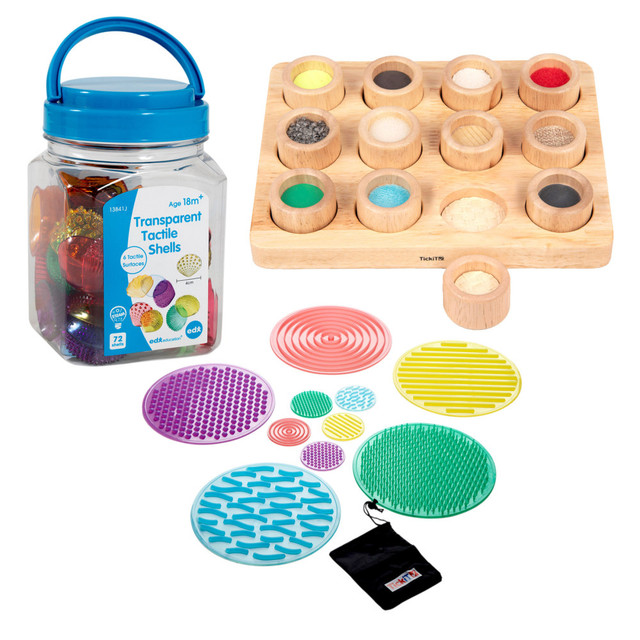 The Learning Advantage Sensory Tactile Kit is great for young learners with sensory needs. This kit includes transparent tactile seashells, a touch and match board and textured sensory circles.  Kit includes a 72 Transparent Tactile Shells, a Touch & Match Board and 10 SiliShapes Sensory Circles.  Seashell-shaped pieces come in 6 different transparent and textures.  Made with durable plastic and without edges.  Includes an activity guide and plastic jar with lid.  Touch & Match Board allows kids to match the 12 different textures with their corresponding textured surface on the board.  Board constructed with wood.  SiliShapes Sensory Circles are made from ultra-soft flexible silicone.  On the surface of each circle is a pattern which is distinctive and different from the rest of the set.  Feely bag provided.