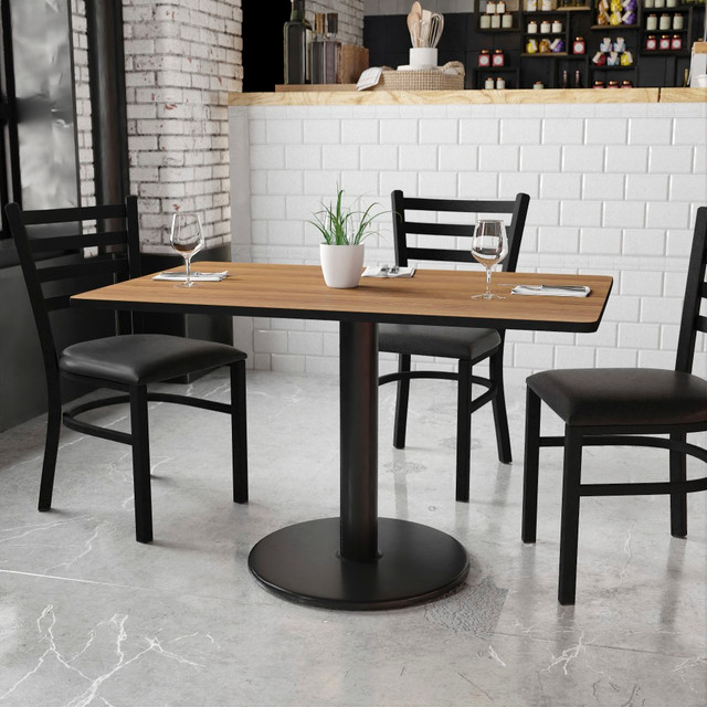 Get guests together around the Flash Furniture Laminate Rectangular Table Top With Round Table-Height Base. This table offers a powder-coated cast-iron base to handle everyday use. The top sports a melamine core and a laminate finish, helping to fend off damage from heat, moisture and scratches.  Designed for commercial use.  1-1/8in-thick top features a melamine core, a heat-, scratch- and moisture-resistant laminate finish and a protective T-mold edge band.  24in round base is made of cast iron with a powder-coated finish and a 4in-diameter column.  Chrome foot ring measures 19-1/2in in diameter.  Top can be cleaned using water/mild detergent and a dry cloth.  Assembly required.  Backed by the manufacturers 5-year limited warranty.  This product is heavy and/or oversized and may need more than one person to handle.