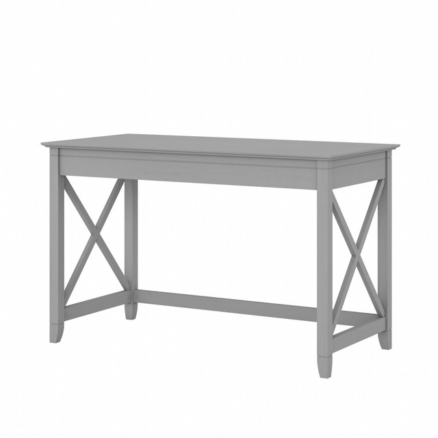 The Key West 48inW Writing Desk features a versatile design that allows it to serve as a personal workspace, sofa table or console table. Available in your choice of several attractive finishes, this small computer desk makes a great addition to homes that embrace the casual charm of coastal and farmhouse decor.  Durable 48inW x 24inD desktop offers plenty of room to spread out with materials.  Writing Desks 30inH design is ideal for use as a sofa table, console table or personal work area.  Unique X pattern accents on side panels gives the small computer desk a relaxed and airy appearance.  Work surface easily supports a computer, books and more with a 200 pound weight capacity.  Table desk is finished on all sides to look great facing any direction.  Sturdy and attractive post leg design withstands years of use in a home office or living room.  Multiple finish options allow you to choose the perfect farmhouse style for any living space.  Surface accepts Desktop Organizers (sold separately) for convenient storage of paperwork and supplies.  Tested to meet ANSI/SOHO quality standards for safety and performance.  Backed by the Bush Furniture 1 Year Manufacturers Warranty.  Backed by the Bush Furniture 1-Year Manufacturers Warranty. For additional information, please visit: www.bushfurniture.com/returnsexchanges  Assembly Required.  Standard Delivery Service. Furniture is delivered unassembled.