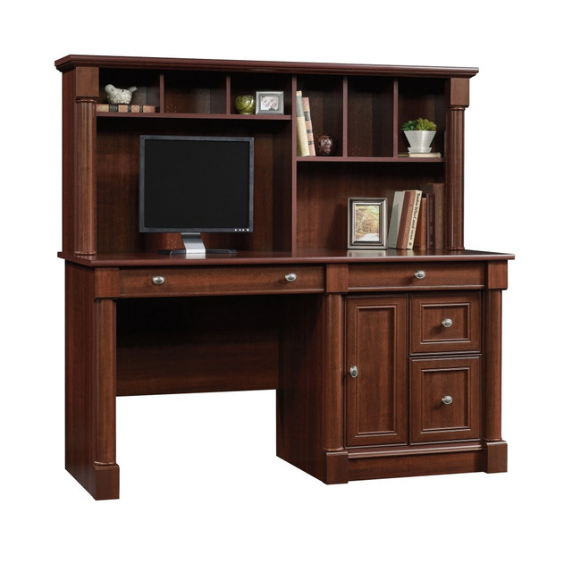 With multiple storage areas, the Sauder Palladia Computer Desk With Hutch brings more than a timeless aesthetic to your home office. Tuck office supplies inside  the storage drawers and cupboard, and use the file drawer to keep documents organized. The cable-management system and keyboard/mouse tray help you maintain a workspace with plenty of elbow room. Thanks to the hutch, this Sauder wood computer desk gives you additional storage space that wonT take up valuable square footage.  Made from engineered wood.  2 storage drawers with metal runners.  Full-extension file drawer holds letter-size hanging files.  Cupboard with an adjustable shelf.  Easy-glide keyboard/mouse tray with a flip-down panel.  Hutch with vertical storage compartments and cubbies.  Cable management.  Assembly required.  59-1/2inW Sauder cherry desk  is attractively finished.  This product is heavy and/or oversized and may need more than one person to handle.