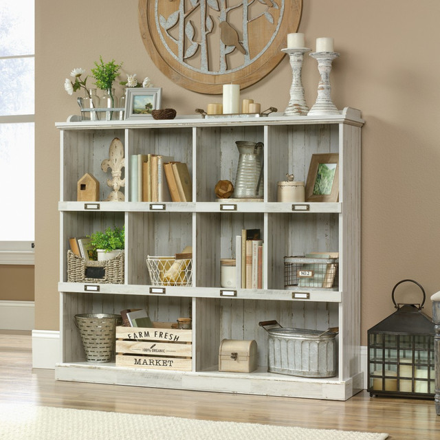 From bins of accessories to family photos, this bookcase lets you organize it all from A to Z. Each cubby can be labeled, so you will know exactly where everything goes.  10 cubbies offer plenty of storage options.  Each shelf supports up to 40 lb.  Engineered-wood construction offers a country cottage appearance.  ID tag holders make it easy to organize the cubbies.  Assembly required.  Cubbyhole and cube storage bookcase design  ID label tags add function and organization  Top shelf details offer space for gallery and picture frame display  White Plank finish  This product is heavy and/or oversized and may need more than one person to handle.