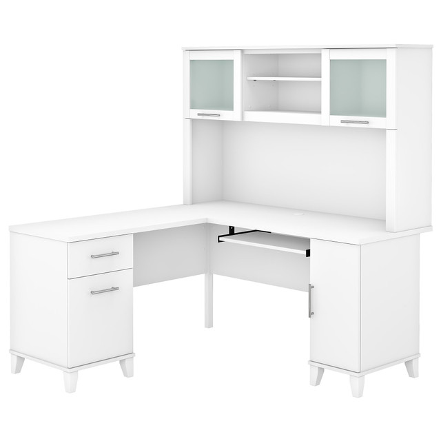 Make a professional statement and maximize your home office capabilities with the Somerset L-Shaped Desk with Hutch. The beautiful and functional corner desk design includes a vertical storage cabinet for binders, manuals or supplies. This expansive workspace allows plenty of room to complete large projects and storage solutions to stay organized.  Bundle includes: 60inW L-Desk and 60inW Hutch.  Constructed of laminate over engineered wood.  Expansive surface provides plenty of room for computer, phone, printer and more.  Pull-out keyboard or laptop tray, pedestals and hutch mount on left or right side for configuration flexibility.  Concealed storage cabinet for a computer tower or supplies with rear wire access.  Box drawer stores office supplies.  File drawer glides on smooth ball-bearing slides and accommodates letter-size documents.  Hutch has closed storage areas with lift-up frosted glass doors.  Open compartments in hutch for books, binders and decorations.  Meets ANSI/SOHO test standards for performance and safety.  Desktop weight tested to support 200 lb.  File drawers weight capacity tested to support 20 lb.  Assembled Dimensions: 59-1/6inW x 59-1/6inD x 64-1/2inH.  Assembly Required.  Standard Delivery Service. Furniture is delivered unassembled.  This product is heavy and/or oversized and may need more than one person to handle.