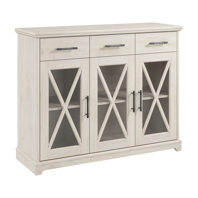 The Bush Furniture Lennox 46inW Farmhouse Sideboard Buffet Cabinet boasts a practical design to help keep your dining area in order while conveying a natural, easy-going charm. An intentionally distressed finish and hardware reflect the best elements of coastal and farmhouse styling to fit perfectly in homes that embrace a more relaxed vibe.  46inW Farmhouse Sideboard Buffet Cabinet is an ideal way to keep your dining area or living space organized.  2 cabinets with adjustable shelves offer plenty of space for dining room essentials. Each shelf supports up to 50 lb.  Tempered glass doors with X accents showcase your best dinnerware while still keeping valuable items safely tucked away.  3 drawers with smooth ball-bearing slides are perfect for storing eating utensils, napkins, coasters and other small items.  Durable surface makes a great serving area and can also be used to brighten up the room with plants, pictures and decorations.  Dining room buffets distressed finish and hardware reflect the best elements of coastal and farmhouse styling.  Tip Guard safety features and wall attachment hardware make the credenza cabinet a kid and pet-friendly choice.  Bush Furnitures commitment to safety includes rigorous testing that meets or exceeds industry standards.  Coordinating items in the Lennox Collection include home office desks, bookcases, file cabinets, living room tables and more.  Sideboard Cabinet is backed by the Bush Furniture 1-Year Manufacturers Warranty.  Assembly required.  Standard Delivery Service. Furniture is delivered unassembled.  Assembled Dimensions: 45-5/16inW x 15-11/16inD x 35-15/16inH.  This product is heavy and/or oversized and may need more than one person to handle.