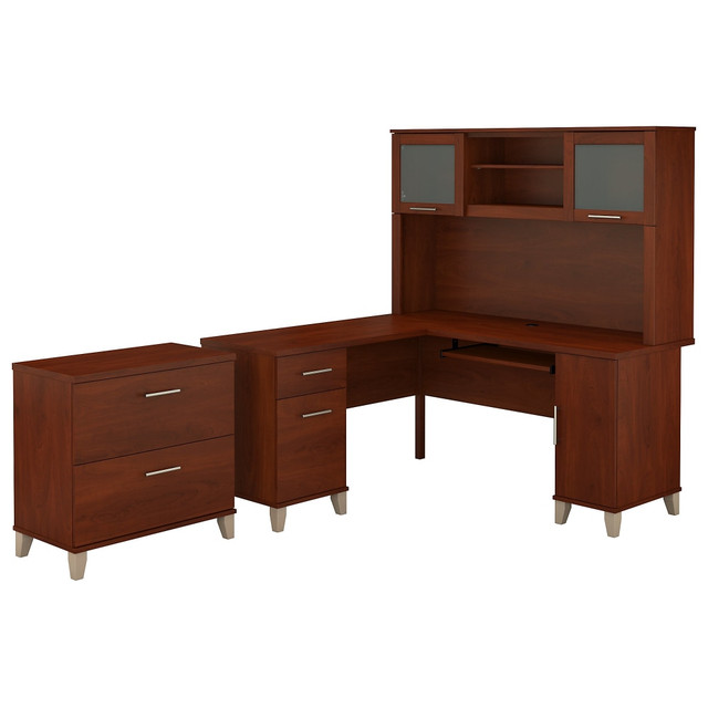 The Somerset L Shaped Desk with Hutch and Lateral File Cabinet offers all the space and storage needed to build a practical home office. With transitional styling that includes an attractive finish, contemporary metal hardware and tapered leg accents, this office furniture set is a perfect choice for those who value style as well as function.  Worksurface weight capacity tested to support 200 lb.  Desk includes a pull out keyboard or laptop tray.  L Shaped Desk offers box and file drawers in addition to a vertical storage compartment.  File drawers open on full-extension ball-bearing slides and hold legal and letter sized documents.  File drawer weight capacity tested to support 60 lb.  Hutch features an open compartment and closed storage areas with lift-up frosted glass doors.  2 Drawer Lateral File Cabinet has interlocking mechanism to reduce the likelihood of tipping.  Meets ANSI/SOHO test standards for safety.  Assembly Required.  Standard Delivery Service. Furniture is delivered unassembled.  Backed by the Bush Furniture 6-Year Manufacturers Warranty. For additional information, please visit: www.bushfurniture.com/ReturnsExchanges.  60inW surface with wire management provides plenty of room for a computer, phone, printer and more.  Bundle includes: 60inW L Shaped Desk, 60inW Hutch, Lateral File Cabinet  Assembled Dimensions: 59-3/16inW x 59-3/16inD x 64-7/8inH  Backed by the Bush Furniture 6-Year Manufacturers Warranty. For additional information, please visit: www.bushfurniture.com/ReturnsExchanges  This product is heavy and/or oversized and may need more than one person to handle.