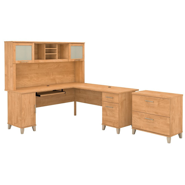 The Somerset L Shaped Desk with Hutch and Lateral File Cabinet offers all the space and storage needed to build a practical home office. With transitional styling that includes an attractive finish, contemporary metal hardware and tapered leg accents, this office furniture set is a perfect choice for those who value style as well as function.  Worksurface weight capacity tested to support 200 lb.  Desk includes a pull out keyboard or laptop tray.  L Shaped Desk offers box and file drawers in addition to a vertical storage compartment.  File drawers open on full-extension ball-bearing slides and hold legal and letter sized documents.  File drawer weight capacity tested to support 60 lb.  Hutch features an open compartment and closed storage areas with lift-up frosted glass doors.  2 Drawer Lateral File Cabinet has interlocking mechanism to reduce the likelihood of tipping.  Meets ANSI/SOHO test standards for safety.  Assembly Required.  Standard Delivery Service. Furniture is delivered unassembled.  Backed by the Bush Furniture 6-Year Manufacturers Warranty. For additional information, please visit: www.bushfurniture.com/ReturnsExchanges.  72inW surface with wire management provides plenty of room for a computer, phone, printer and more.  Bundle includes: 72inW L Shaped Desk, 72inW Hutch, Lateral File Cabinet  Assembled Dimensions: 71inW x 70-7/8inD x 64-7/8inH  Backed by the Bush Furniture 6-Year Manufacturers Warranty. For additional information, please visit: www.bushfurniture.com/ReturnsExchanges  This product is heavy and/or oversized and may need more than one person to handle.