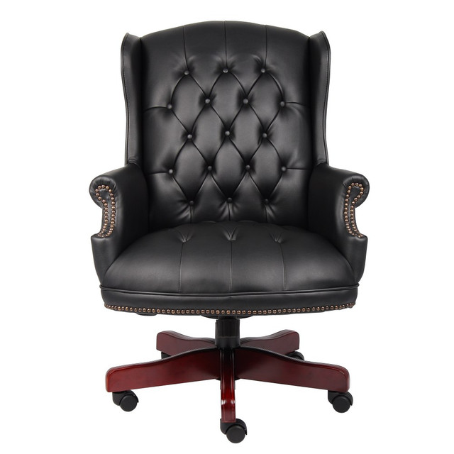 Check off everything on your task list while seated on the Boss Office Products Vinyl High-Back Executive Chair. With a design that complements your sophisticated taste, this high-back desk chair looks professional with soft vinyl upholstery and a handsome frame. This Boss office chair keeps your body at ease with lumbar support and multiple adjustments that suit meetings, typing and reflecting on a job well done.  Weight capacity tested to support 250 lb.  Lumbar feature supports your lower back and enhances the natural curve of your spine.  Waterfall seat cushion slopes slightly downward to help reduce stress on your legs.  Vinyl upholstery.  Tilt angle, tension and lock.  Adjustable arm height and width.  Durable wood frame with casters.  Assembly required.  Boss high-back desk chair is finished in black and mahogany.  Tested to meet ANSI/BIFMA Performance Standards - Manufacturer testing has been conducted on this product to meet specific performance requirements and safety standards set forth by the American National Standards Institute (ANSI) and the Business and Institutional Furniture Manufacturers.  This product is heavy and/or oversized and may need more than one person to handle.