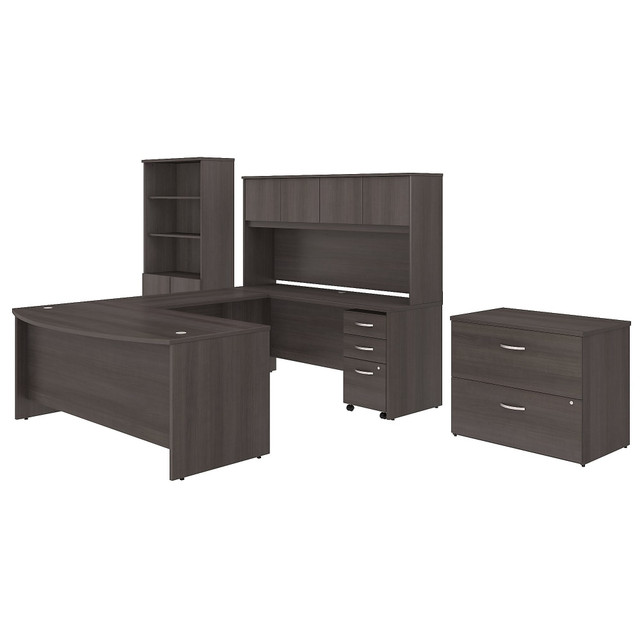 Give your office the workspace you need and the style you deserve. The Studio C U Shaped Desk with Hutch, Bookcase and File Cabinets combines classic designs with a contemporary finish for the modern workplace. Count on the commercial-grade office furniture set to help you feel organized and productive for years to come.  Bundle includes: 72inW x 36inD Bow Front Desk, 72inW x 24inD Credenza Desk, 42inW Desk Return, 72inW Hutch, 3 Drawer Mobile File Cabinet, 36inW Lateral File Cabinet, 36inW 5 Shelf Bookcase with Door Kit.  Assembled Dimensions: 71inW x 101inD x 72 4/5inH  Thermally fused laminate finish fends off scratches and stains to protect the office furniture set.  Bow Front Desk surface offers extended space for guests to collaborate.  Desktop weight capacity tested to support 200 lb.  4 Hutch doors provide plenty of storage room and include self-closing Euro-style hinges.  Lateral File Cabinet and Mobile File Cabinet lock to secure your letter, legal and A4 size paperwork with drawers gliding on smooth full-extension ball-bearing slides.  Mobile File Cabinet includes 2 box drawers with 1 file drawer and rolls wherever you need it.  Bookcase with Doors contains 3 adjustable shelves and 2 fixed shelves to hold books, accessories and more.  Bookshelf weight capacity tested to support 50 lb.  Available in your choice of several contemporary and traditional finishes to fit any work environment.  Commercial quality backed by the Bush Business Furniture 10-Year Manufacturers Warranty. For additional information, please visit: www.bushbusinessfurniture.com/ReturnsExchanges  Assembly Required.  Standard Delivery Service. Furniture is delivered unassembled.  Tested to meet ANSI/BIFMA Performance Standards - Manufacturer testing has been conducted on this product to meet specific performance requirements and safety standards set forth by the American National Standards Institute (ANSI) and the Business and Institutional Furniture Manufacturers.  This product is heavy and/or oversized and may need more than one person to handle.