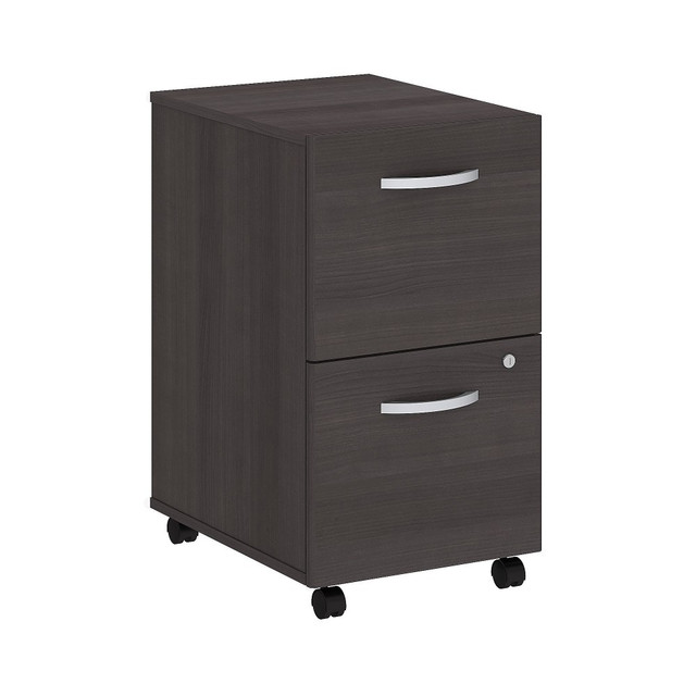 The Studio C Mobile File Cabinet rolls with you throughout your office. Dual-wheeled, hooded casters keep the cabinet moving wherever you want or remain in place on your office floor or carpet. You will have your paperwork organized in no time as the Mobile File Cabinet ships fully assembled.  Assembled Dimensions: 15 5/7inW x 20 1/6inD x 27 7/8inH  Thermally fused laminate finish fends off scratches and stains.  Mobile File Cabinet rolls wherever you need it on two fixed and two swivel casters.  Brushed Nickel hardware complements your choice of several attractive finishes for a contemporary or traditional look.  File drawers glide on smooth full-extension ball-bearing slides so you will easily access all contents.  Cabinet stores letter, legal and A4-size files while locking for your security.  Conveniently fits under coordinating Studio C Desks (sold separately).  Commercial quality backed by the Bush Business Furniture 10 Year Warranty. For additional information, please visit: www.bushbusinessfurniture.com/ReturnsExchanges  Standard Delivery Service - Partially Assembled. Furniture is delivered partially assembled., assembly required  Tested to meet ANSI/BIFMA Performance Standards - Manufacturer testing has been conducted on this product to meet specific performance requirements and safety standards set forth by the American National Standards Institute (ANSI) and the Business and Institutional Furniture Manufacturers.