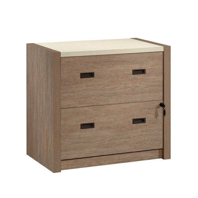 The thick, strong, and lightweight panel construction of the lateral filing cabinet from the Dixon City collection allows for easier portability in your home office, unlike heavy, clunky, metal filing cabinets. Featuring a locking bottom drawer for security of confidential information, this residential office furniture provides an additional safeguard for important paper files. The business file cabinet drawers each have full extension slides and hold letter or legal-size hanging files for easy and adaptable file retention. An interlocking safety mechanism prohibits both drawers from opening simultaneously, avoiding accidental tip-overs. Finished on all sides for versatile placement in a home office or living space, this 2-drawer lateral file cabinet meets BIFMA standard x5.9 for safety, durability, and structural performance.  Bring the soothing simplicity of a modern farmhouse to your office space with commercial filing cabinets, like this one.  Strong and lightweight 1-1/4in and 2in panel construction for added style and design.  Two drawers with full extension slides hold letter or legal size hanging files.  Interlocking safety mechanism allows only one drawer open at a time.  Bottom drawer has key lock for secure storage.  Finished on all sides for versatile placement in any room.  Meets BIFMA standard x5.9 for safety, durability, and structural performance.  This product is heavy and/or oversized and may need more than one person to handle.