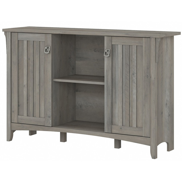 Complete your home office, hallway, bedroom or living room with Salinas storage options. Its a great way to get organized in a variety of spaces. An organized home has never felt so right.  Constructed of laminate over engineered wood.  Tapered legs, curved base rails, decorative wood details and vertical accents inspired by timeless Mission style.  Elegant metal drop pull hardware finished in Tumbled Pewter.  Bush Storage Cabinet contains one adjustable shelf behind each door and another in center compartment.  Storage cabinet doors have a slightly distressed finish for a casual look.  Assembly required.  Standard Delivery Service. Furniture is delivered unassembled.