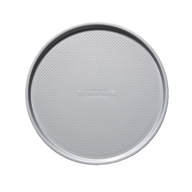Every night is pizza night with the THE ROCK WAVE By Starfrit Carbon Steel Nonstick Round Perforated Pizza Pan. This pan is made of carbon steel for durability, and it has a nonstick surface for easy food release and cleaning.  Made of durable carbon steel.  Nonstick surface allows for easy food release and cleaning.  Thick rolled edges help prevent pan deformation.  Perforations offer even heat distribution.  Oven safe up to 450 deg.F (230 deg.C).  Dishwasher safe.  PFOA free.
