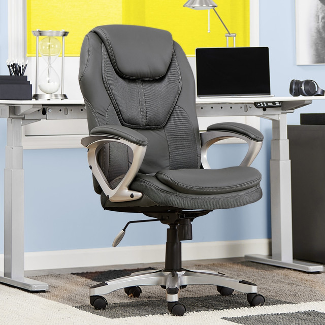 Put your best foot forward in the Serta Works Faux Leather Office Chair. Use the height and tilt adjustment to tailor the fit to suit you and your workspace, and enjoy the smooth maneuverability the swiveling, rolling design brings to the table. Designed with lumbar support and a sloping seat, this ergonomic, mesh-back office chair delivers both style and comfort.  Weight capacity tested to support 250 lb.  Lumbar feature supports your lower back and enhances the natural curve of your spine.  Waterfall seat cushion slopes slightly downward to help reduce stress on your legs.  Racing-style design with a mesh backrest and faux leather seat.  Height and locking tilt adjustments.  Swivels and rolls.  Padded arm rests.  Assembly required.  Tested to meet ANSI/BIFMA Performance Standards - Manufacturer testing has been conducted on this product to meet specific performance requirements and safety standards set forth by the American National Standards Institute (ANSI) and the Business and Institutional Furniture Manufacturers.