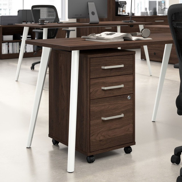 Keep your workspace organized with the Bush Business Furniture Vista 3 Drawer Mobile File Cabinet. This mobile file cabinet offers three spacious drawers for storing documents and office supplies and conveniently rolls anywhere you need it in your office. Its compact design and mobility make it a practical and stylish storage solution.  3 Drawer Mobile File Cabinet keeps your documents and essentials organized and clutter-free, providing efficient storage for your workspace.  Cabinet offers one file drawer for legal, letter and A4-size paperwork and two box drawers for organizing small office supplies.  Drawers open on smooth full-extension ball bearing slides for an easy reach to office items and files  box drawers support up to 15 pounds each, while the file drawer supports up to 30 pounds.  Filing cabinet features a single lock that secures the two bottom drawers to protect sensitive documents and personal items.  Cabinet rolls on practical dual-wheeled casters for mobility and fits under coordinating Vista desks.  Unit is finished on all sides to look great facing any direction in a private office or open floor plan.  Available in your choice of contemporary finishes paired with attractive brushed nickel hardware.  Bush Business Furnitures commitment to safety includes rigorous testing that meets or exceeds ANSI/BIFMA x5.5 commercial test standards.  Backed by a 10 Year Manufacturers Warranty.  North American made with globally sourced materials