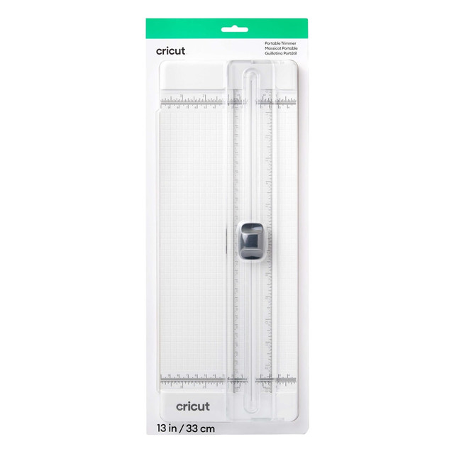 Trim paper with precision using the Cricut Portable Trimmer. This trimmer boasts an ergonomic grip for lasting comfort.  Durable plastic construction.  Easy-glide blade system allows precise, straight cuts.  Dual-hinged rail lets you quickly load, measure and cut materials.  Built-in safety guard.  Ergonomic grip provides comfort.  Continuous measuring marks (cm and in) afford accuracy.  Storage compartments hold on to replacement blades.  Works with vinyl, iron-on, paper, Smart Materials and more.  Compatible with most Cricut cutting machines.