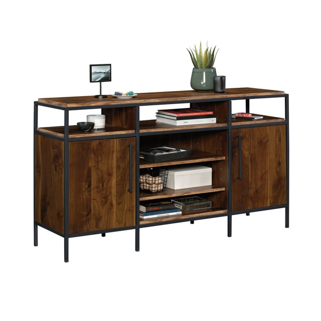 Update your entertaining space with a Sauder Nova Loft Credenza For 65in TVs. With 4 adjustable shelves, you can choose a configuration that works best for you and your setup. Keep your space looking tidy and free from messy cords with cord management holes.  Compatible with TVs up to 65in.  Made from metal and engineered wood.  3 open cubbies.  2 doors  Assembly required.  This product is heavy and/or oversized and may need more than one person to handle.