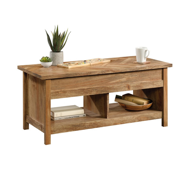 The vintage look of this lift-top coffee table adds a classic look to your living room thats sure to complement just about existing decor. Use the hidden storage area to make sure that your everyday accessories are neatly stored away.  Made of tough particleboard that can endure the wear and tear of daily use.  Hidden storage area offers a spot to keep a spare blanket and pillow.  Open shelving lets you keep board games, books and other items neatly stored away.  Lift-top surface turns the table into a versatile work station.  Furnished on all sides for placement almost anywhere in the room.  Assembly required.  This product is heavy and/or oversized and may need more than one person to handle.