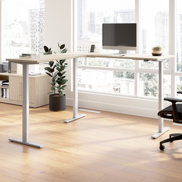 Treat yourself to a healthier, more productive workspace with the Move 60 Series L Shaped Standing Desk from Bush Business Furniture. Sit-stand desks have been shown to reduce the pain and discomfort associated with sedentary work while also positively impacting job performance, and Move 60 provides an affordable ergonomic office solution.  Your New Favorite Desk: L Shaped Standing Desk includes a motorized base with 72W x 30D and 48W x 24D surfaces  assembled L desk measures 72W x 78D.  Resists Damage: Durable thermally fused laminate desktop offers superior resistance to scratches, stains, and other cosmetic damage.  Stable Workstation: Welded 16 gauge steel base provides superb structural strength, giving the corner standing desk a weight capacity of 200 pounds.  Fits People of all Heights: Adjustable desk surface lifts anywhere from 27 to 46.7 inches from the floor at a speed of 0.78 inches per second.  Easy to Use, Intuitive Controls: Simple control panel allows for quick adjustments  just lift up or press down to change the L shaped sit-stand desks height.  Programmable Settings: Two presets save your preferred sitting and standing heights while a customizable sedentary alert reminds you to change positions.  Safe for Home and Office: Anti-Collision Sensor Reacts quickly to stop the electric desk from moving when an object is in the way.  Quiet Motor and More: Ergonomic desk features a quiet UL-listed electric motor  included 10-foot power cord plugs into a standard wall outlet.  Meticulously Tested: Meets or exceeds ANSI/BIFMA quality standards for safety and performance.  Built to Last: Backed by the Bush Business Furniture 5 Year Manufacturers Warranty  This product is heavy and/or oversized and may need more than one person to handle.