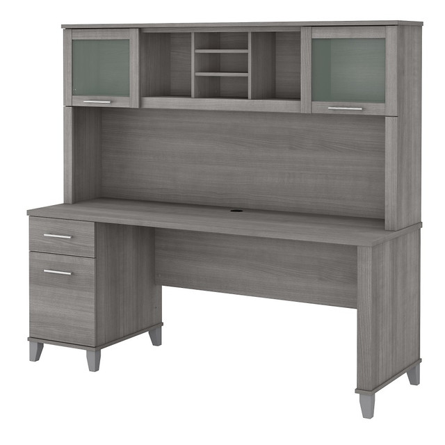 With a large work surface and plenty of storage for important documents and supplies, the Somerset 72W Office Desk with Hutch presents an ideal workspace solution for those who value style as well as function. Transitional styling that includes tapered legs, contemporary metal hardware and an elegant finish excels in a home or professional office.  Bundle includes: 72inW Office Desk with Drawers, 72inW Hutch  Assembled Dimensions: 71inW x 23-2/3inD x 65inH  Spacious 72inW work surface offers plenty of room to spread out with a computer and paperwork.  Worksurface weight capacity tested to support 200 lb.  Desktop includes a convenient wire management grommet to keep cords and cables out of the way.  File drawer opens on full-extension ball bearing slides and accepts legal and letter size documents.  File drawer weight capacity tested to support 60 lb.  Hutch attaches to the desktop and features 2 lift-up frosted glass doors for concealed storage.  Hutch has open compartments with 2 adjustable shelves for books, binders, decorations and more.  Computer desks box drawer provides storage for office supplies and utensils.  Tested to meet ANSI/SOHO standards for safety and performance.  Assembly Required.  Standard Delivery Service. Furniture is delivered unassembled.  Backed by the Bush Furniture 6-Year Manufacturers Warranty. For additional information, please visit:www.bushfurniture.com/ReturnsExchanges  This product is heavy and/or oversized and may need more than one person to handle.
