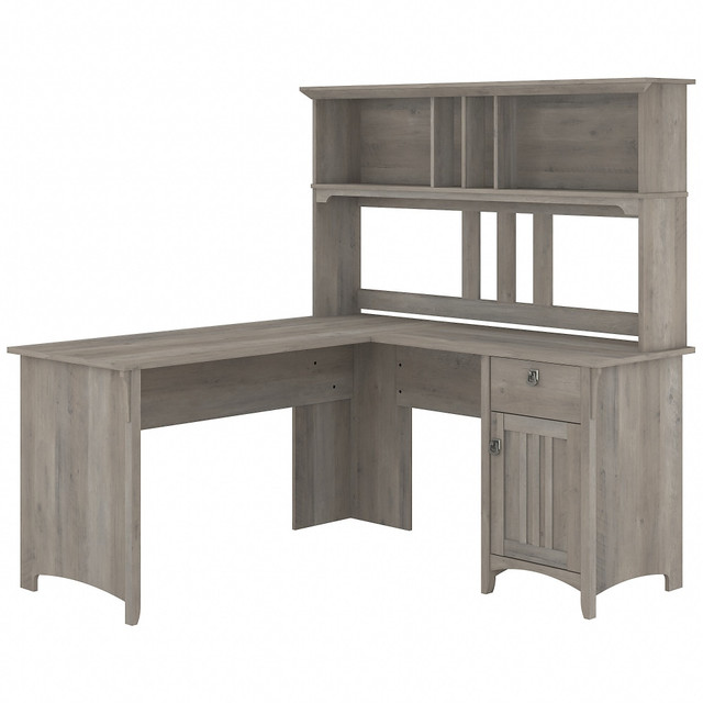 Add a touch of style and comfort to your home office. The Salinas L Shaped Desk with Hutch provides an ideal personal workspace with a large surface area and plenty of room for storage and display. Tapered legs, curved base rails and decorative wood accents inspired by timeless Mission styling look great in your choice of attractive finishes.  Bundle includes: 60inW L Shaped Desk, 60inW Hutch  Assembled Dimensions: 60inW x 60inD x 63inH  Space-saving L Shaped Desk design offers ample workspace and can be placed in a corner.  Work surface weight capacity tested to support 200 lb.  Storage cabinet with adjustable shelf conceals reference materials and miscellaneous items.  Box drawer holds small items such as writing utensils, notepads and other office supplies.  Open storage on Hutch provides plenty of room to display books, photos, decorations and more.  Tapered legs, curved base rails and decorative wood accents inspired by timeless Mission style.  Elegant metal drop pull hardware finished in stylish Tumbled Pewter.  Tested to meet ANSI/SOHO standards for safety and performance.  Assembly Required.  Standard Delivery Service. Furniture is delivered unassembled.  This product is heavy and/or oversized and may need more than one person to handle.
