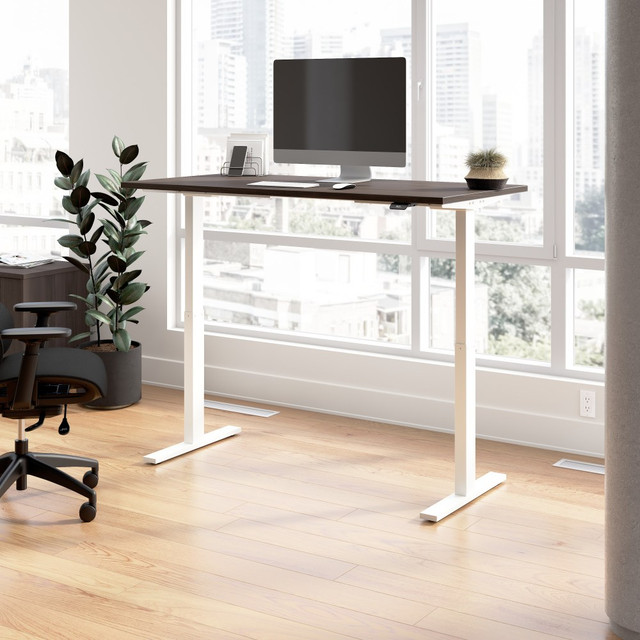 Have a healthy and productive day at the office with the Move 60 Series Electric Height Adjustable Standing Desk from Bush Business Furniture. Those who use sit-stand desks report improved attitudes, energy, and comfort while getting more done, and Move 60 provides an affordable ergonomic office solution.  Your New Favorite Desk: Electric Height Adjustable Standing Desk includes a motorized base and 60W x 30D top surface with built-in wire management.  Resists Damage: Durable thermally fused laminate desktop offers superior resistance to scratches, stains, and other cosmetic damage.  Stable Workstation: Welded 16 gauge steel base legs and feet provide superb structural strength with a weight capacity of 200 pounds.  Fits People of all Heights: Adjustable desk surface lifts anywhere from 27 to 46.7 inches from the floor at a speed of 0.78 inches per second.  Easy to Use, Intuitive Controls: Simple control panel allows for quick adjustments  just lift up or press down to change the sit-stand desks height.  Programmable Settings: Two presets save your preferred sitting and standing heights while a customizable sedentary alert reminds you to change positions.  Safe for Home and Office: Anti-Collision Sensor Reacts quickly to stop the electric desk from moving when an object is in the way.  Quiet Motor and More: Ergonomic desk features a quiet UL-listed electric motor  included 10-foot power cord plugs into a standard wall outlet.  Meticulously Tested: Meets or exceeds ANSI/BIFMA quality standards for safety and performance.  Built to Last: Backed by the Bush Business Furniture 5 Year Manufacturers Warranty  This product is heavy and/or oversized and may need more than one person to handle.