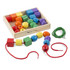 This stringing set includes 30 brightly colored wooden beads in various shapes, offering endless possibilities for creative play. With two extra-long laces, children can develop their hand-eye coordination, fine motor, and cognitive skills as they string the beads together. The set comes with a wooden storage case, making it easy to keep everything organized.  30 brightly colored wooden beads in a variety of shapes  2 colorful laces included  Comes in a convenient wooden storage case  Great for developing hand-eye coordination and fine motor skills  For ages 3+ years  Dimensions: 1.5inH x 7.75inL x 9.25inW packaged