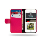 Folded Royale wallet case with wrist strap on surface