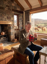 Tartan microfibre cleaning cloth lifestyle image with highland cows in the background