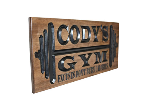 wooden gym sign with barbell