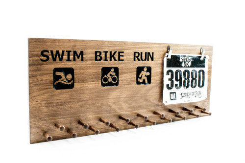 run-bike-swim-triathlon race medal display 