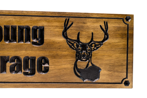 Man cave sign with wrench hand and deer head