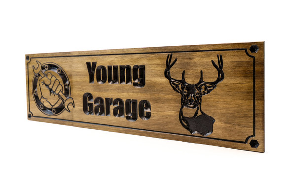 Man cave sign with wrench hand and deer head Man cave sign with wrench hand and deer head