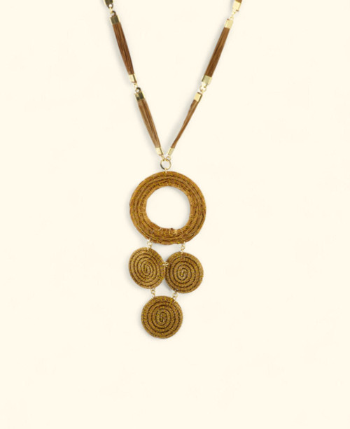 Handwoven necklace with cascading natural medallions