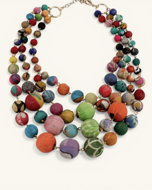 Cultural Elements multi-strand statement necklace with colorful, recycled textile-wrapped beads.