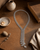 Spiral Elegance Y-Shaped Necklace — necklaces, sunlit shelf lifestyle photo