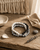 Modern Muse Grey, White, & Black Beaded Bracelet — bracelets, editorial wood lifestyle photo