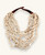 Cultural Elements beige wood disc layered necklace with horn eye and hook closure, 21 inches.