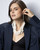 Cultural Elements soft white wood disc necklace with horn closure, twisted strands, 20 inches.